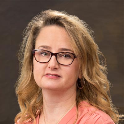 Dr. Leslie Tomek, MD