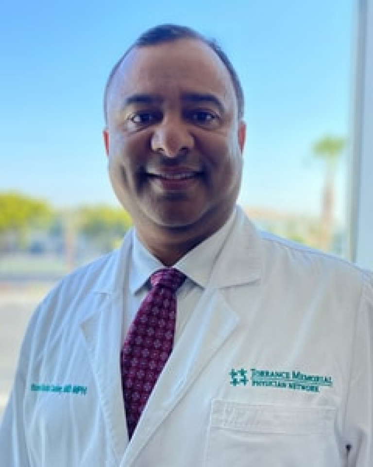 Dr. Rumi Cader, MD