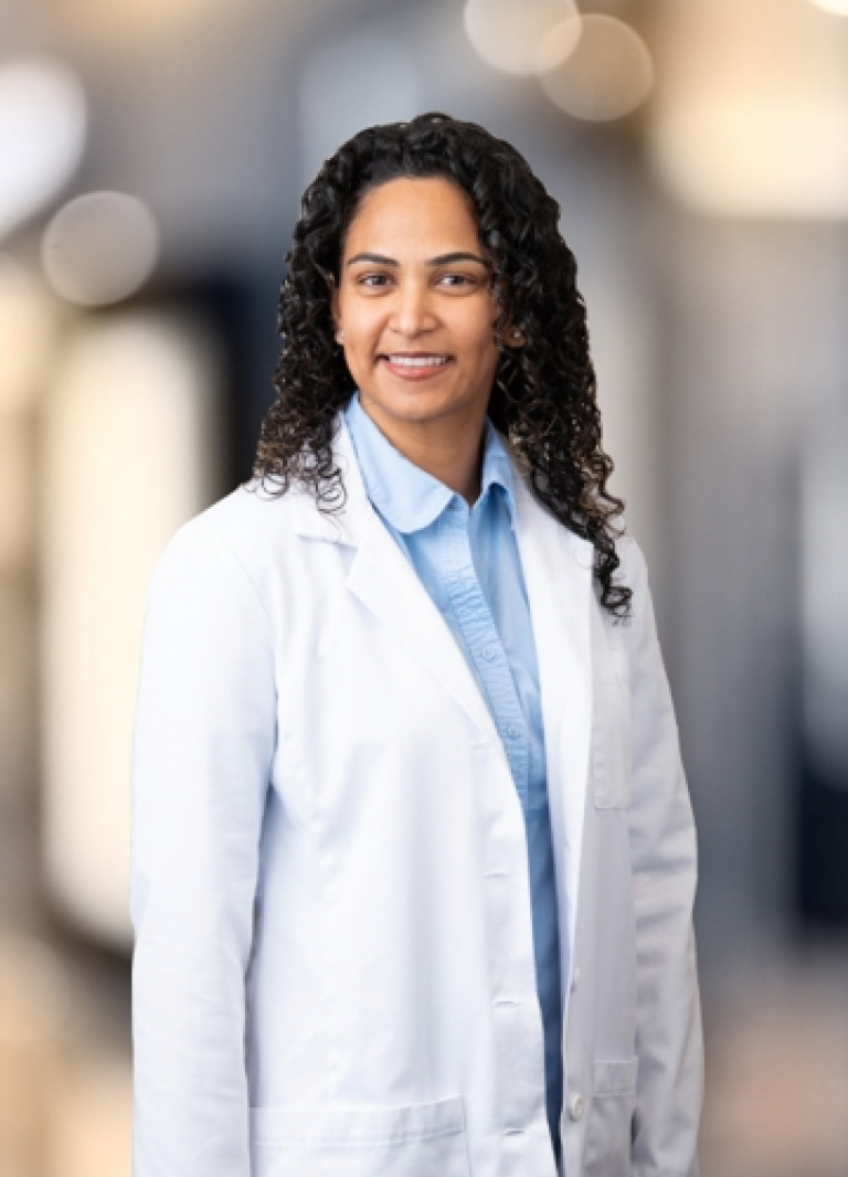 Dr. Sharisse Holinej, MD